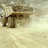 Dust cloud thrown up by a quarry truck