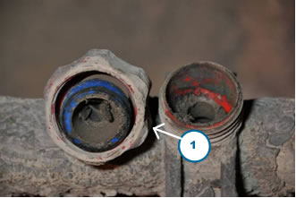 Figure 7 - Spray nozzle unscrewed from feed pipe to show internal contamination