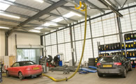 Ventilated workplace using tail pipe extraction