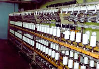 Elastic yarn covering machine