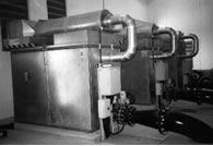 Screw compressors with reactive silencers