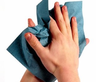 Hands being dried with paper towel