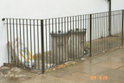 Bins behind a railing