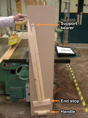 Top side of jig showing support bearer, end stop and handle.